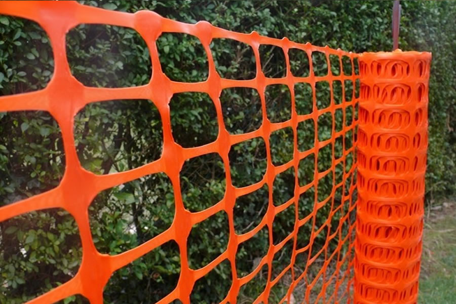 Orange mesh snow fence
